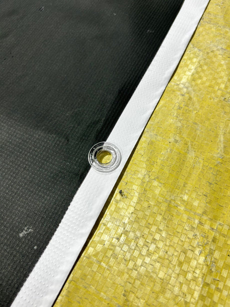 Close up view of a vinyl banner with eyelet for fixing - SS Signs Online Store - Design your own custom vinyl banner