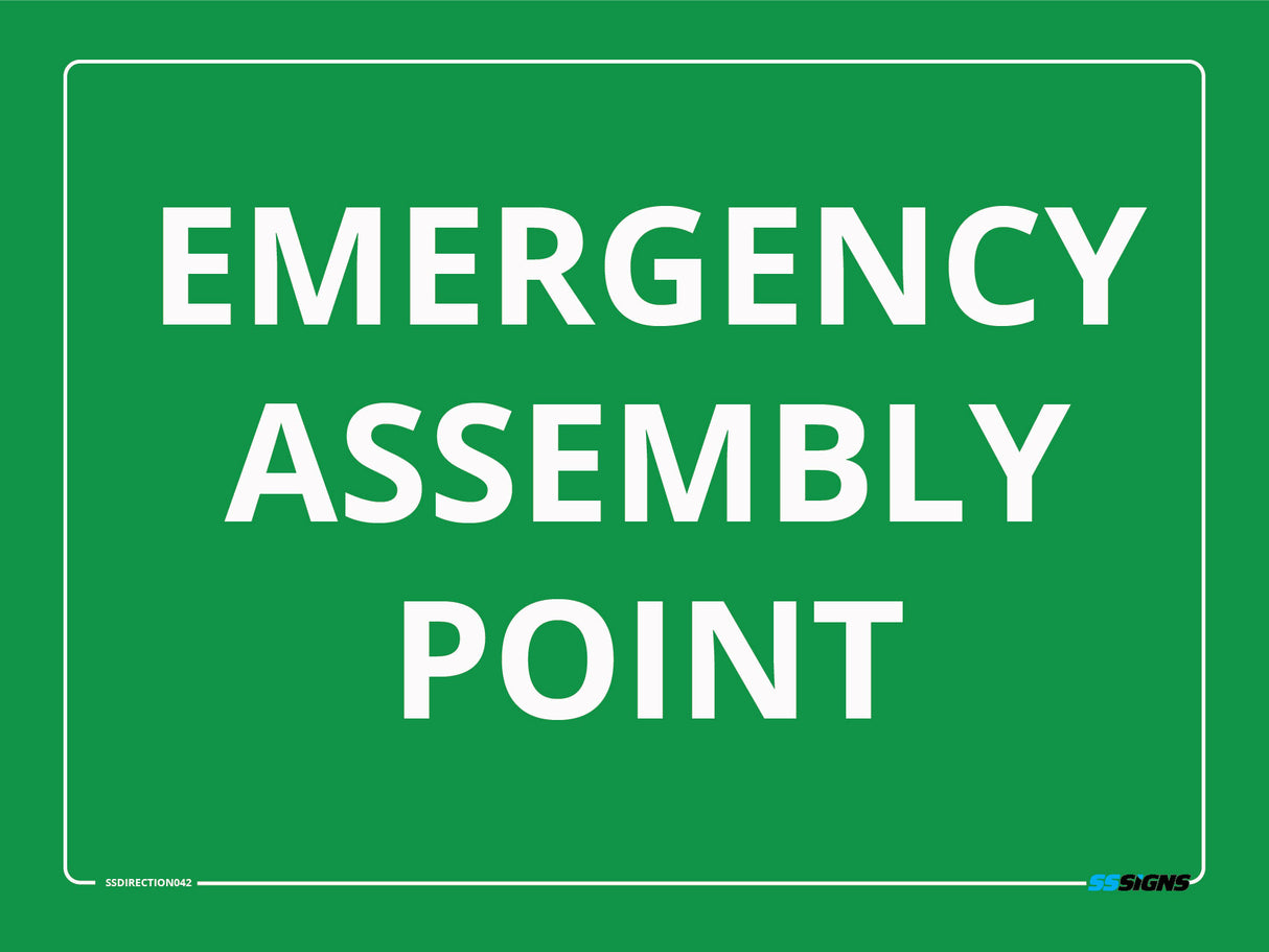 Green site safety sign with 'EMERGENCY ASSEMBLY POINT' text on a green background