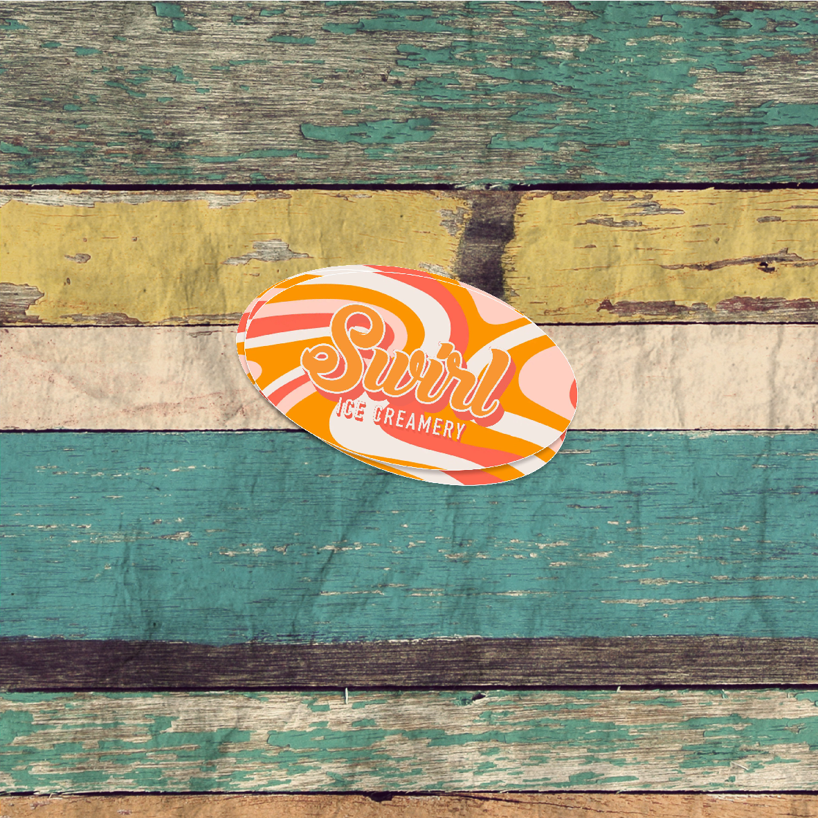 A set of custom oval-shaped stickers with a design, placed on a wooden background. The stickers have a glossy finish and are intended for labeling or personal use.