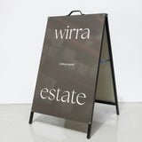 A-frame sign with 'wirra' and 'estate' text on a white background using Aluminium panels with wrapped graphics