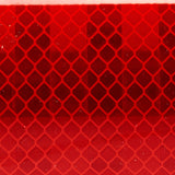 Close-up of red 3M Diamond Series Reflective Tape - Safety through visibility. 