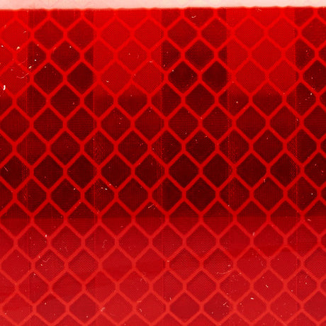 Close-up of red 3M Diamond Series Reflective Tape - Safety through visibility. 